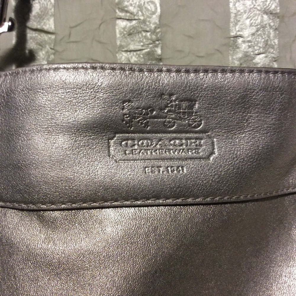 Elegant silver Coach. Mint condition.